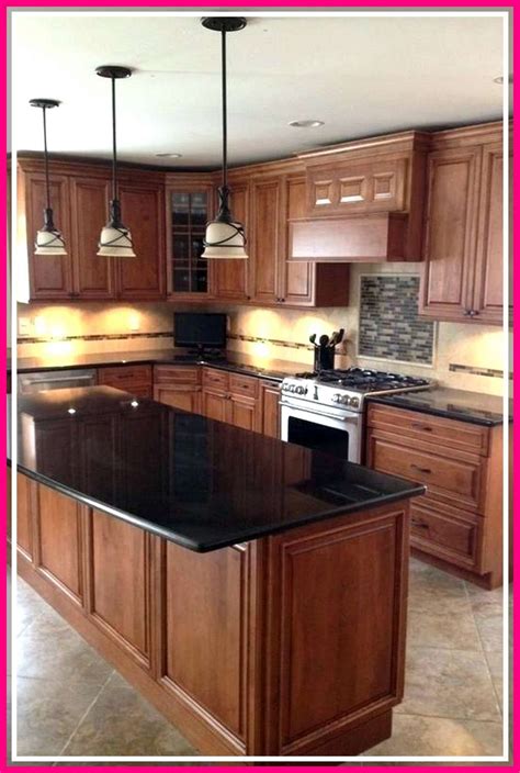 black stainless steel appliances with oak cabinets|oak cabinets with black hardware.